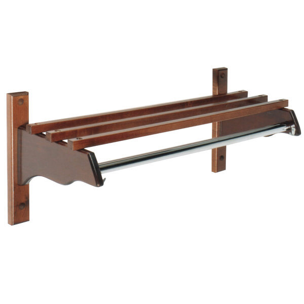A mahogany hardwood wall-mounted coat rack with metal hanging rods.