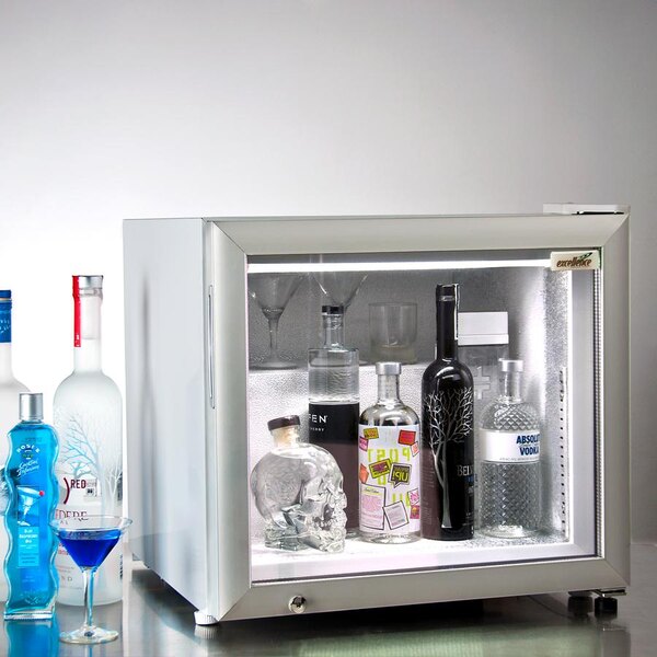 A white Excellence Countertop Display Freezer with bottles and glasses inside.