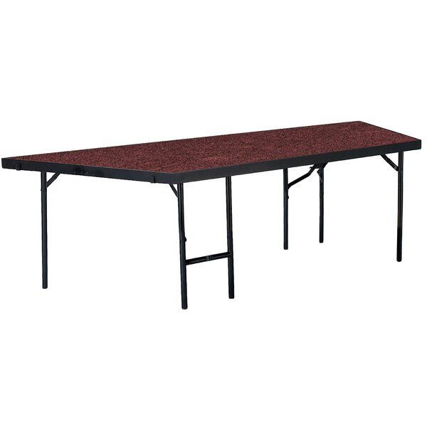 A rectangular table with black legs and a red top.