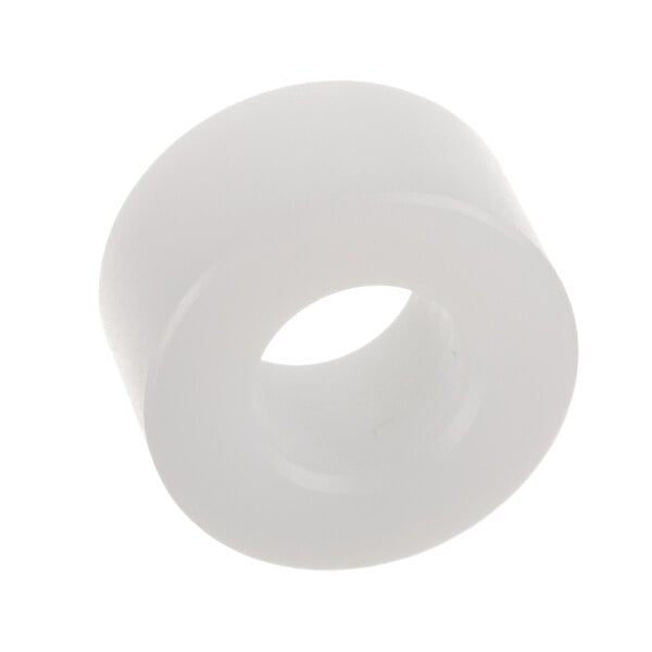 A white UHMW plastic spacer with a hole in it.