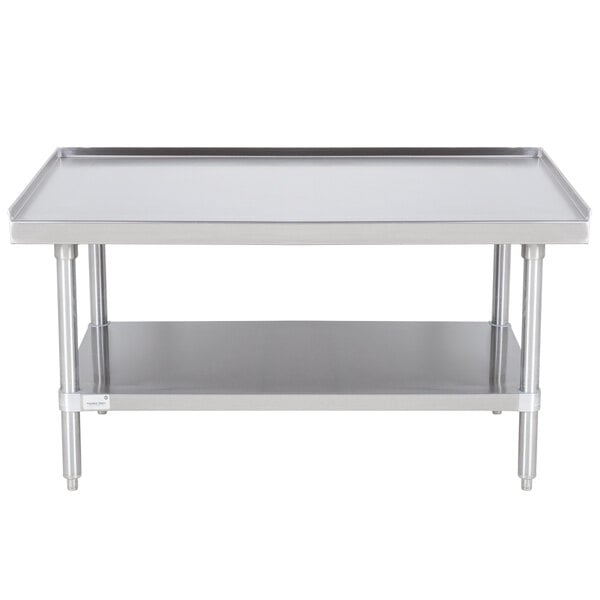 An Advance Tabco stainless steel equipment stand with undershelf on a white table.