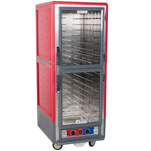 A red and silver Metro C5 holding and proofing cabinet with clear Dutch doors.