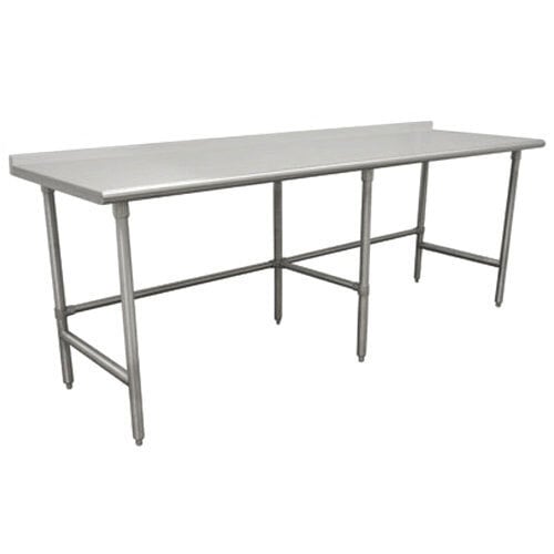 An Advance Tabco stainless steel commercial work table with a backsplash and open base.