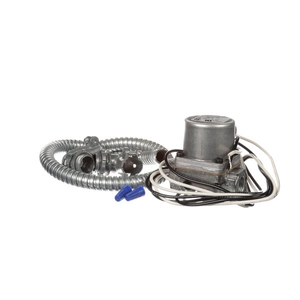 A Keating valve replacement kit with a small electric motor and hose.