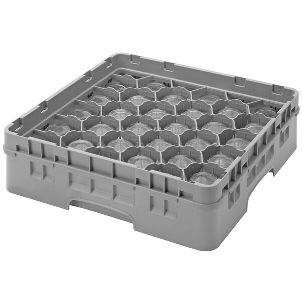 A grey plastic container with many holes.