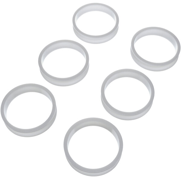 A group of white circular Antunes egg rings.
