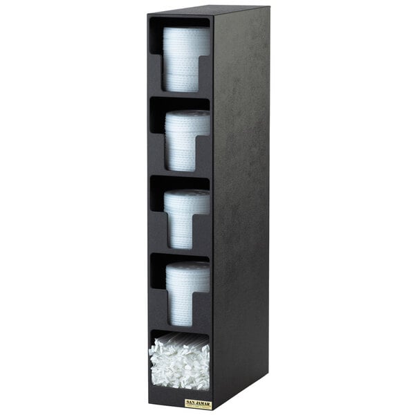 A black San Jamar countertop lid organizer with four white containers inside.
