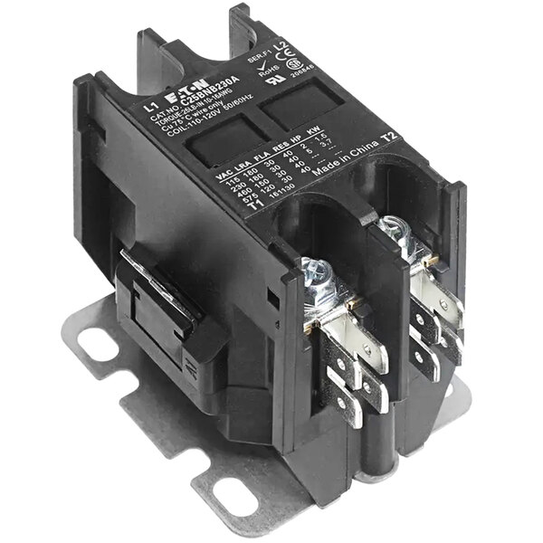 A Grindmaster-Cecilware contactor with two terminals and metal parts.