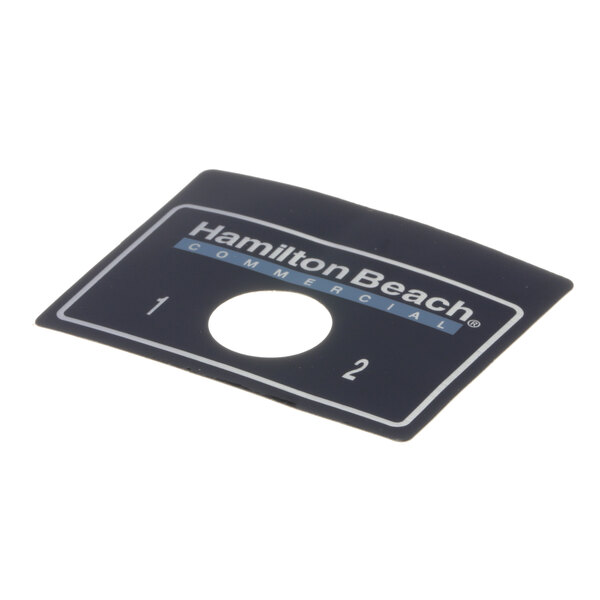 A black rectangular Hamilton Beach switch plate with white text.