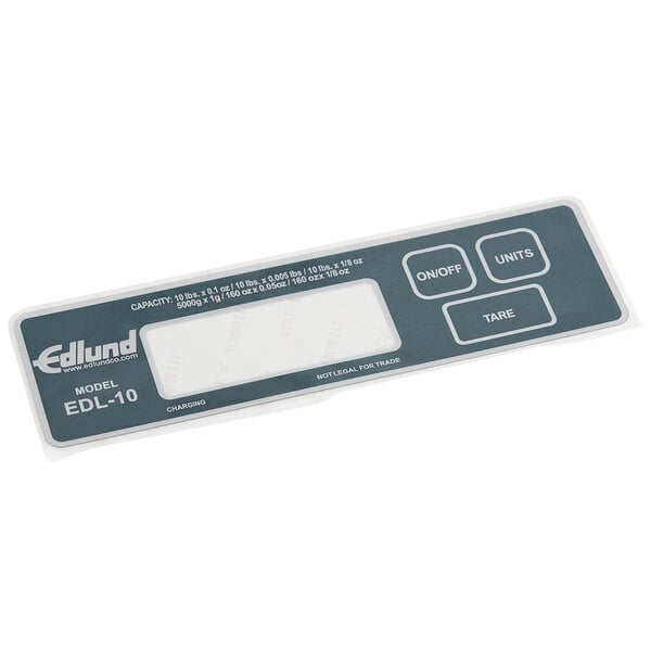 A white plastic Edlund control decal with numbers and letters.