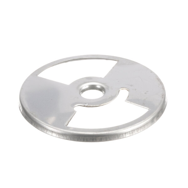 A silver metal disc with a hole in the center.