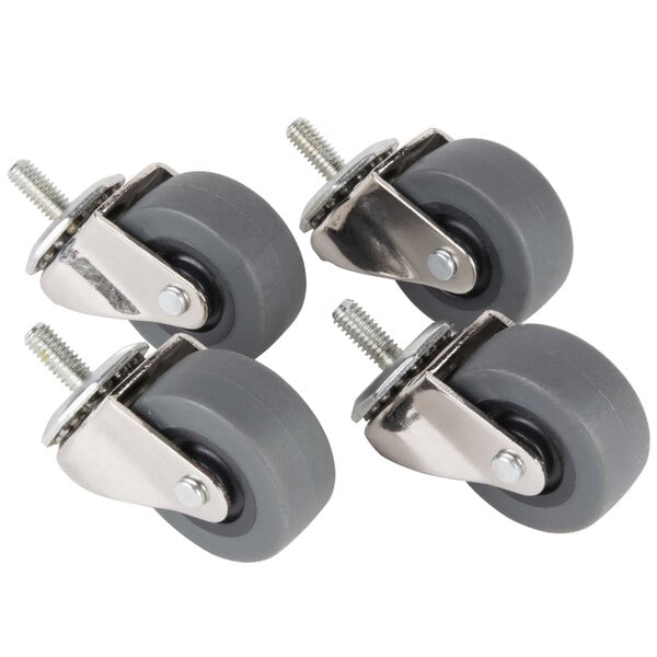 A set of four Manitowoc stem casters with grey rubber wheels.