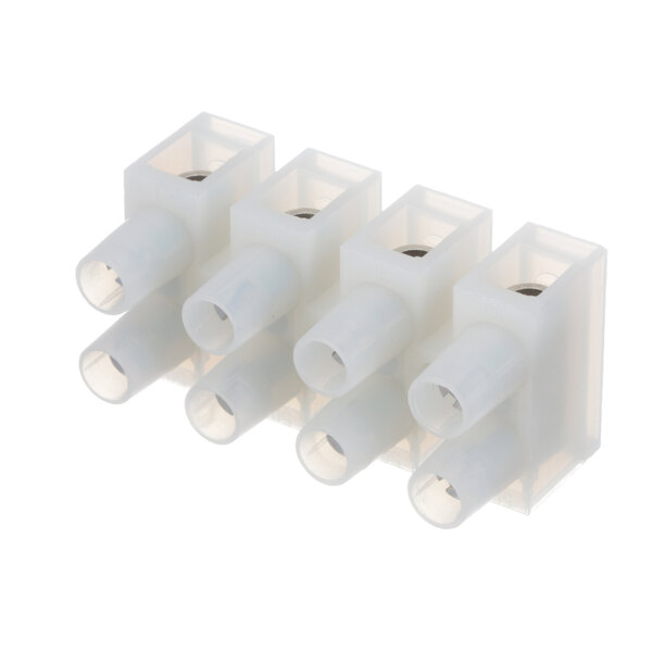 A close-up of several white plastic connectors.