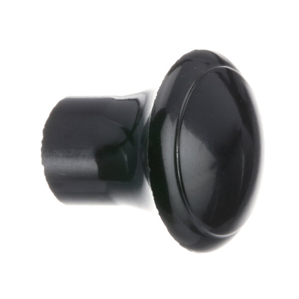 A close-up of a black plastic knob with a round cap.
