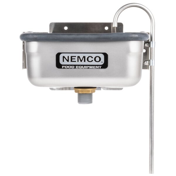 A silver Nemco ice cream dipper well with a faucet.