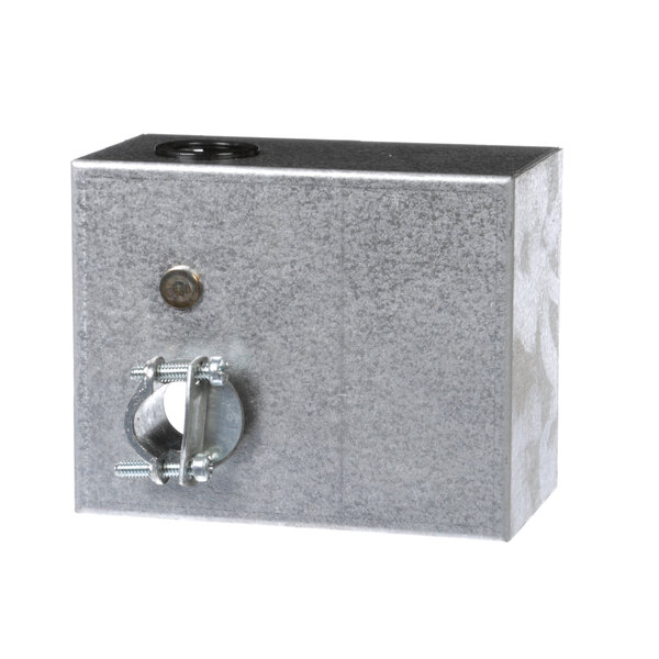A metal control box with a hole in the middle.