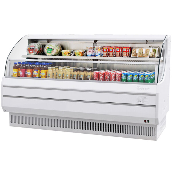A Turbo Air white low profile horizontal air curtain display case with food and drinks.