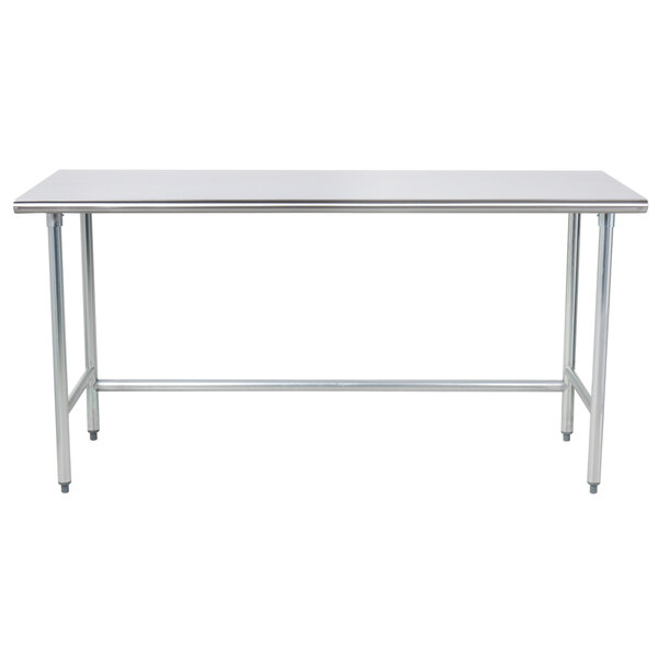 A stainless steel Advance Tabco work table with a metal frame and legs.