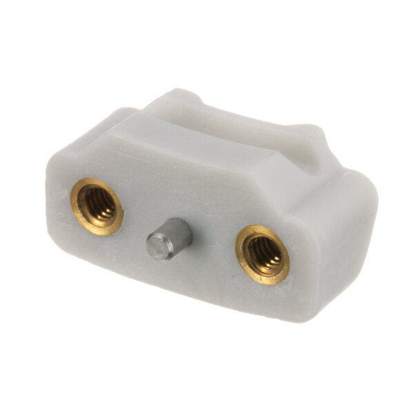 A white plastic Hobart shoe connector with gold and silver screws.