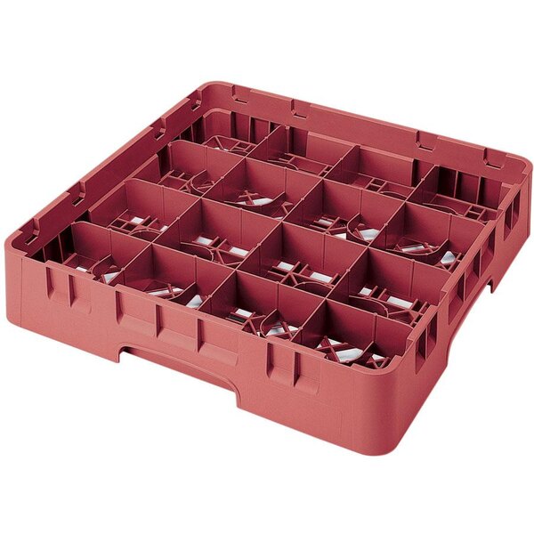 A red plastic Cambro glass rack with 16 compartments and extenders.