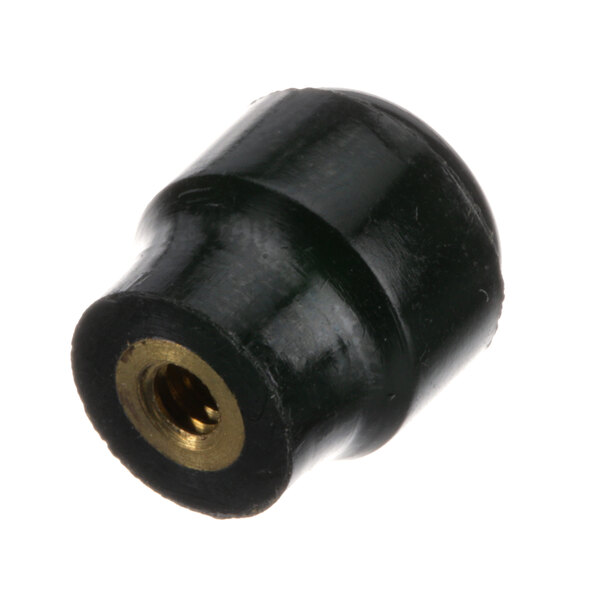A close-up of a black rubber and gold round screw terminal cap.