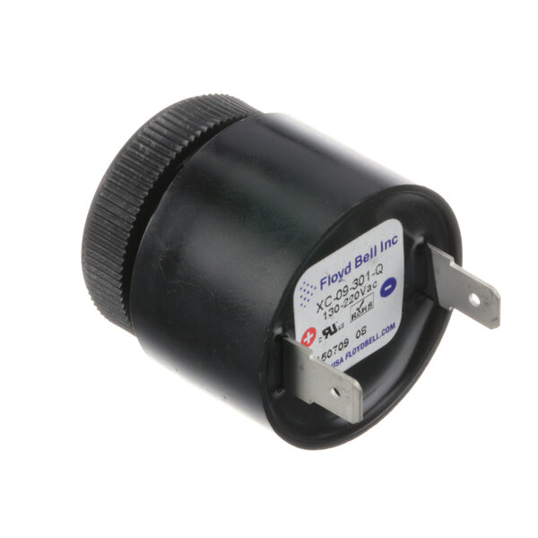 A close-up of a black round NU-VU buzzer with a white label.