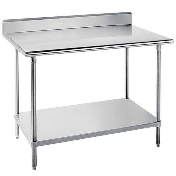 A stainless steel Advance Tabco work table with a galvanized undershelf and backsplash.