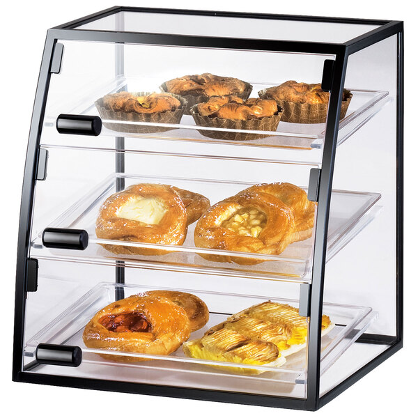 A Cal-Mil iron display case with pastries inside.