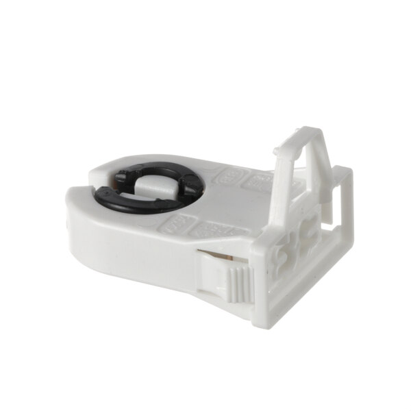 A white plastic Anthony bi-pin socket with a black ring.