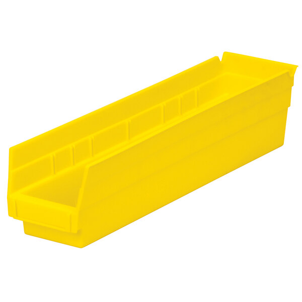 A yellow plastic Metro shelf bin with two compartments.
