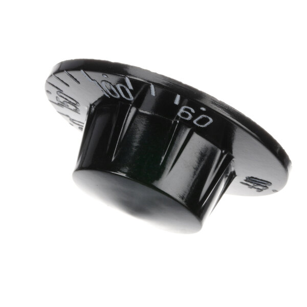 A close-up of a black Continental Refrigerator knob with numbers.