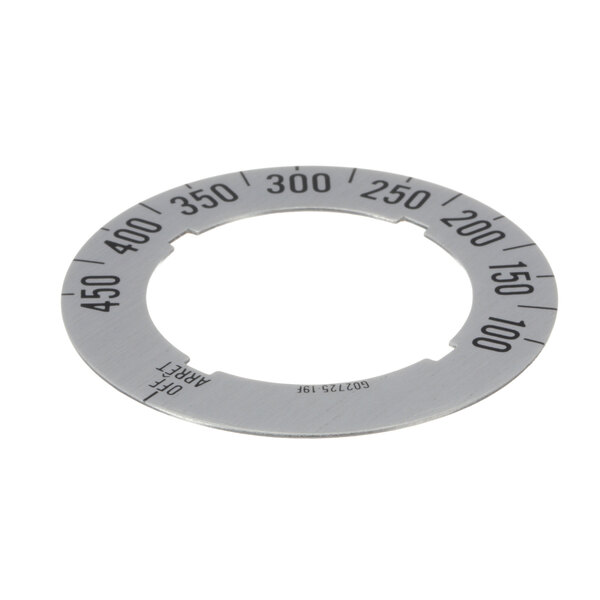 A circular metal Garland dial insert with numbers.