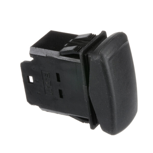 A close-up of a Groen 3 way switch with a black square cover.