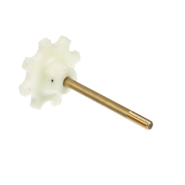 A white plastic gear with a gold metal shaft inside a white plastic gear with a gold metal shaft.