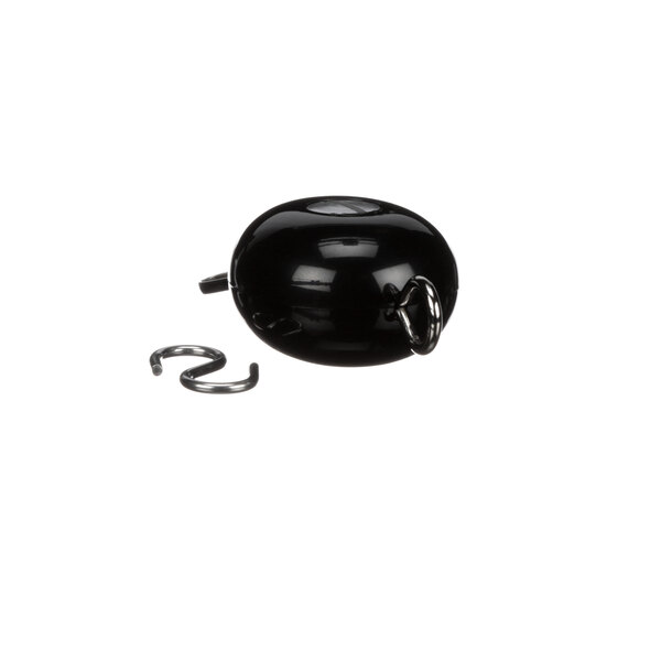 A black round object with a metal handle.