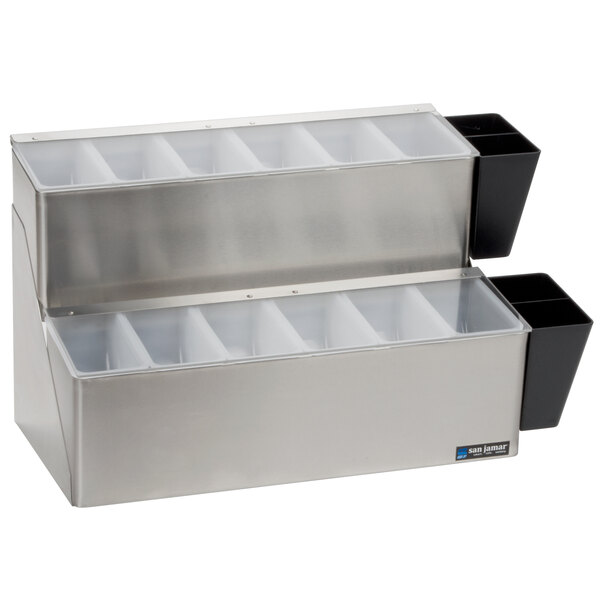 A silver San Jamar stainless steel condiment bar with 12 plastic compartments on a counter.