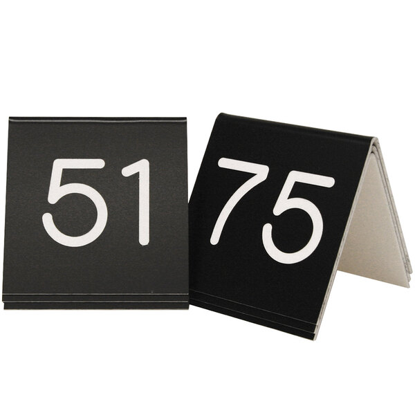 Two black and white Cal-Mil table numbers with the number 51.