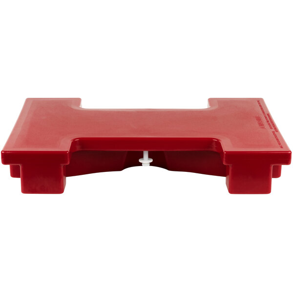 A hot red plastic rectangular connector with white handles.