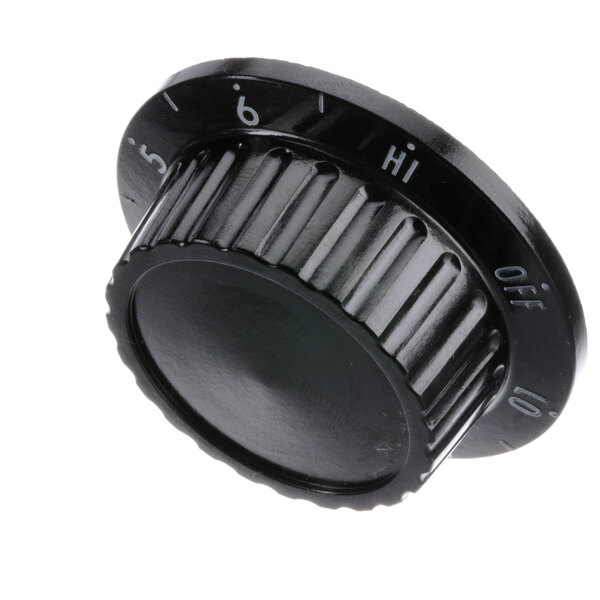 A black Dinex knob with white numbers.