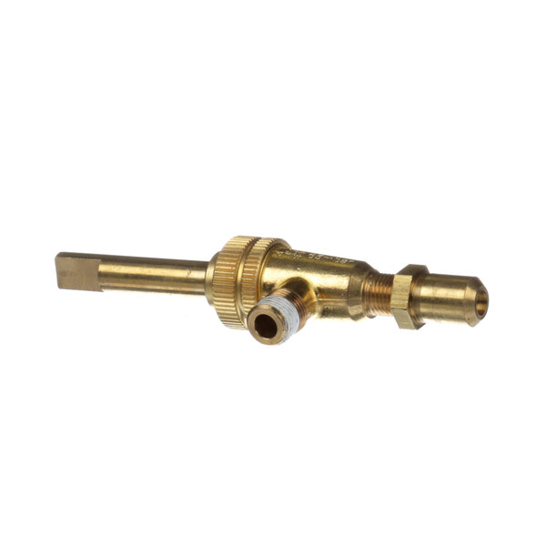 A close-up of a gold metal Montague top burner valve.