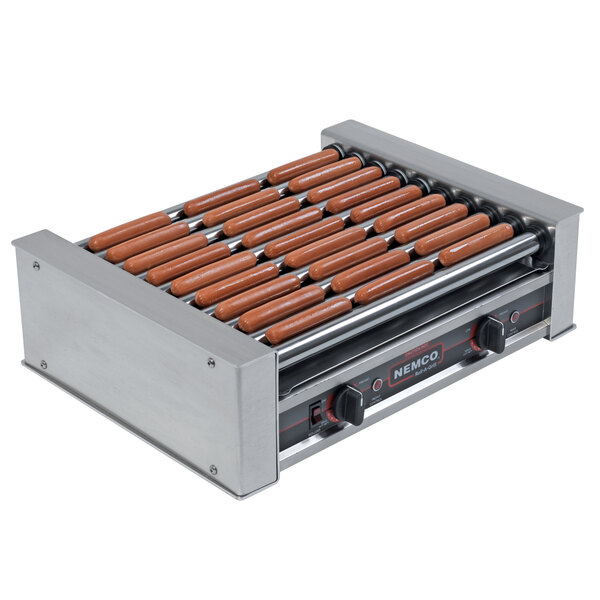 A Nemco hot dog roller grill with hot dogs cooking.