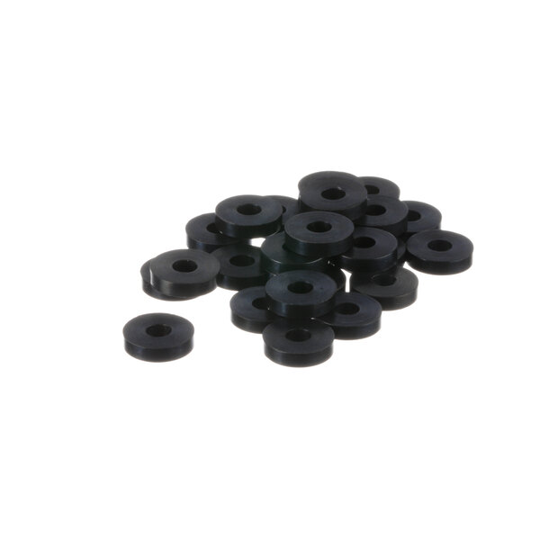 A pile of black rubber washers on a white surface.