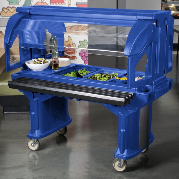 A navy blue Cambro food cart with a salad bar on it.
