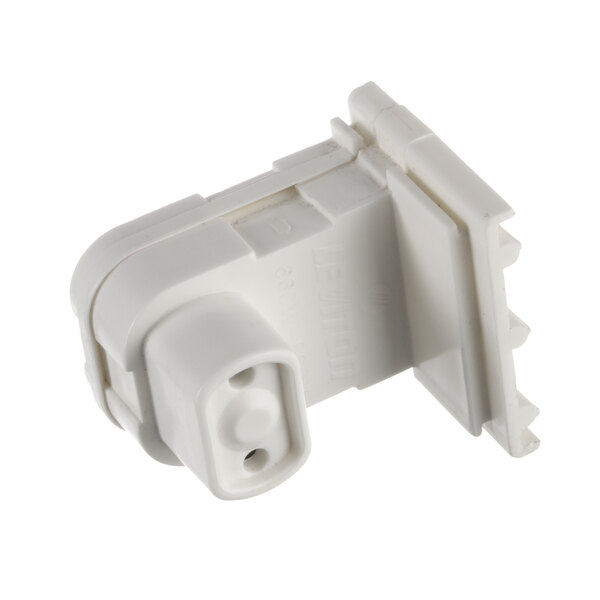 A close-up of a white plastic connector.