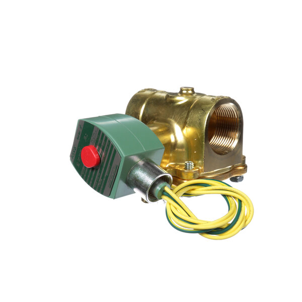 A close-up of a brass Groen solenoid valve with a green and yellow electrical wire attached.
