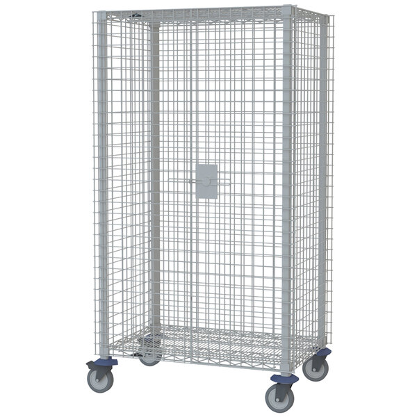 A large white metal MetroMax Q security cage on wheels with a lock.