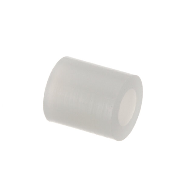 A white plastic spacer with a small hole in it.