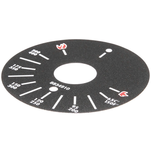 A black circular dial plate with white and red text for a Bakers Pride thermostatic griddle.
