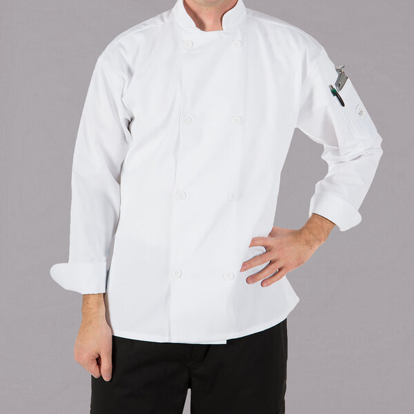 A man wearing a white Mercer Culinary long sleeve chef's coat.