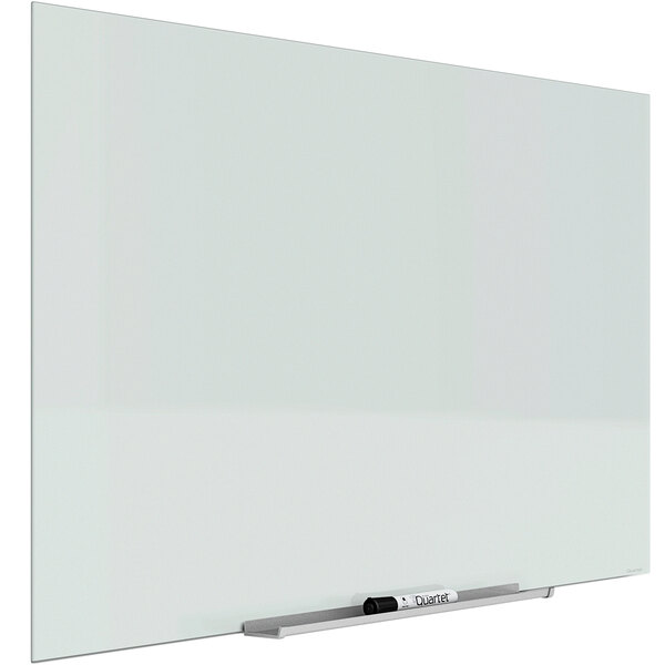 A white Quartet frameless magnetic glass markerboard with a black marker on it.